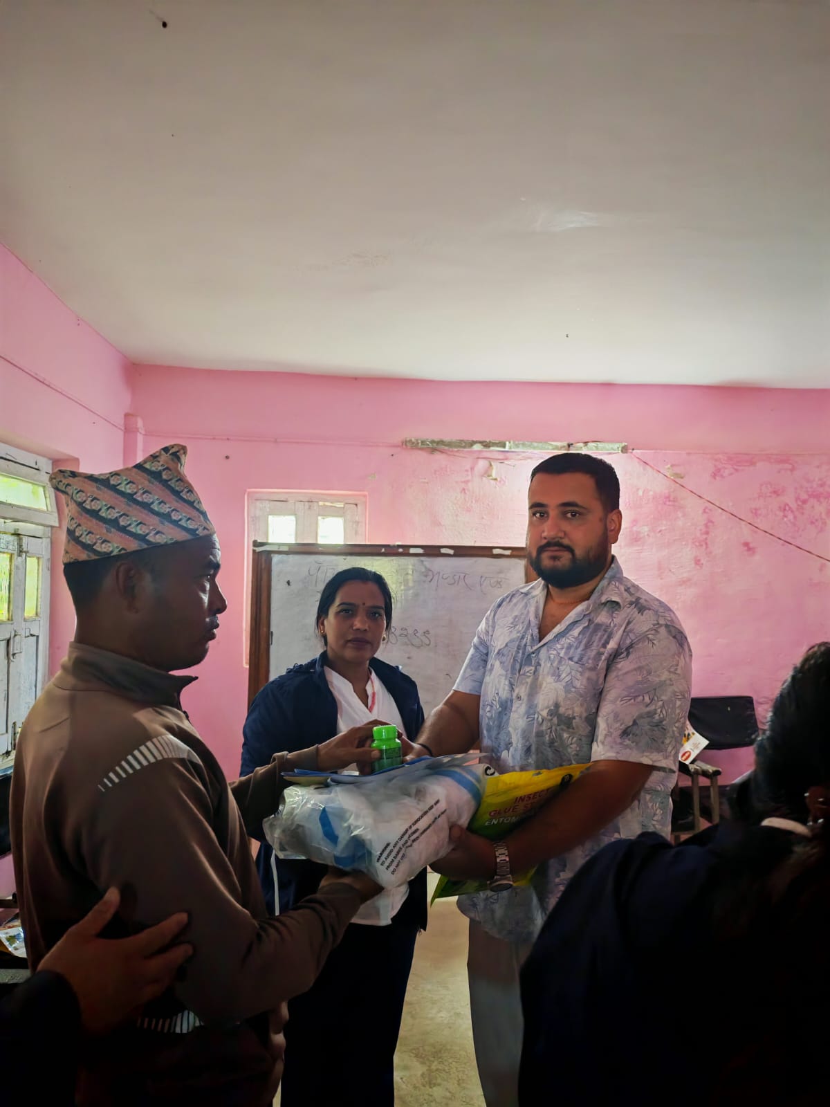 Protective aprons being distributed to farmers during the CSR initiative